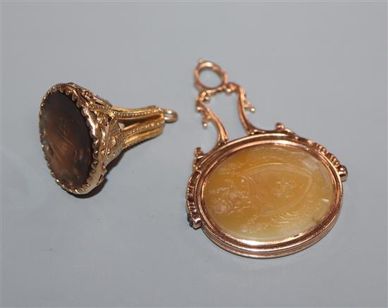 A Victorian yellow metal and chalcedony spinning fob seal and a 1960s 9ct gold and gem set seal.